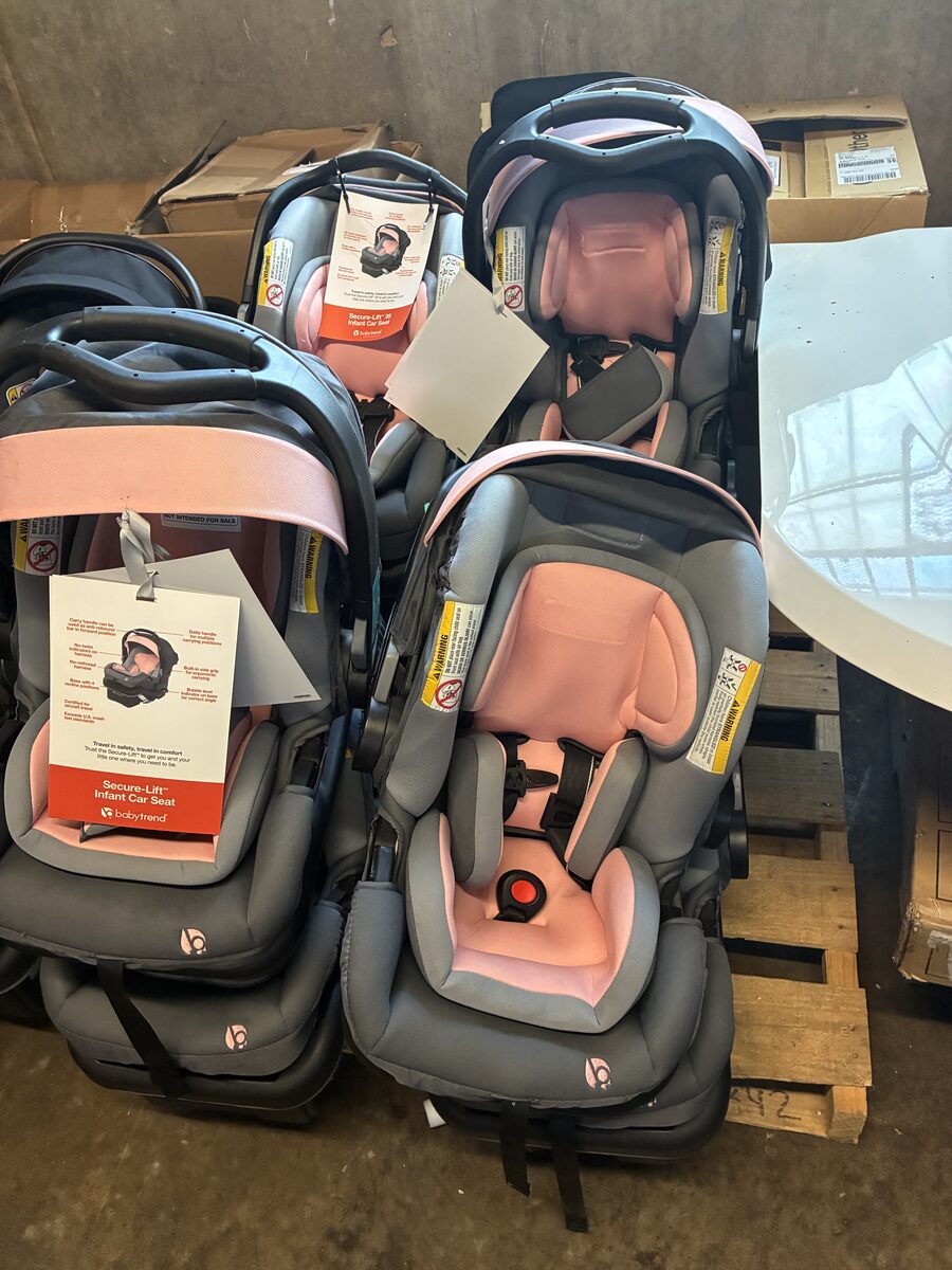Infant car seat shown upright in the warehouse